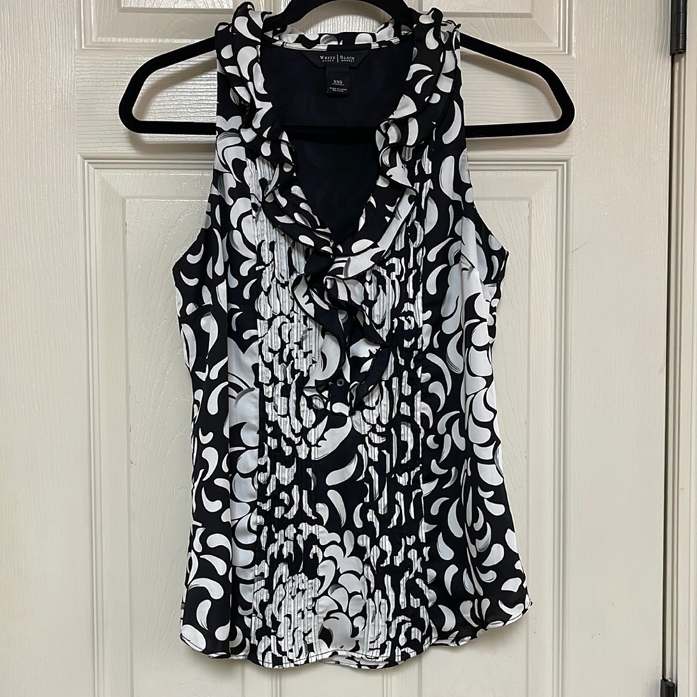 White House black market sleeveless top. Has black liner. Size XXS.